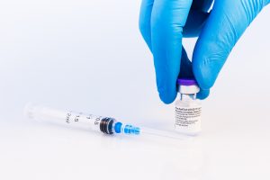 Pfizer says third dose protects against Omicron, business travel meets hesitancy, and an alliance forms to combat AI hiring bias